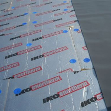 How many fixings are required to secure a flat roofing system?